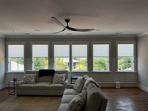Cozy living room showcasing honeycomb shades